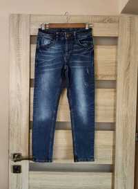 granatowe spodnie jeansowe reserved 140