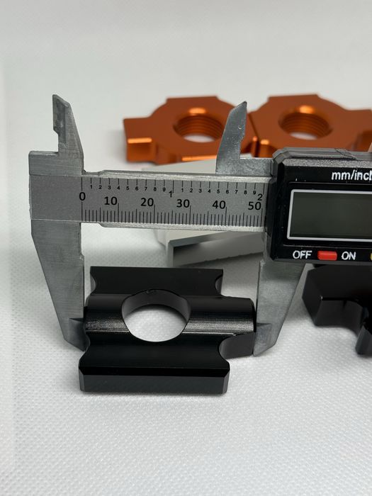 Блок регулювання натяжника для ланцюга