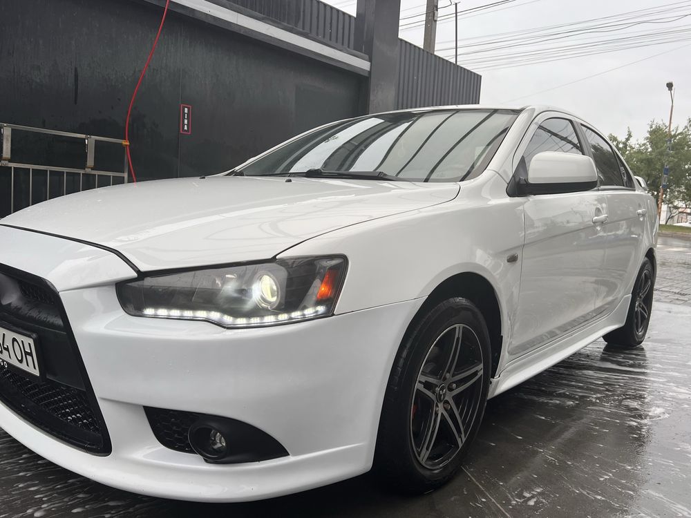 Mitsubishi Lancer 2012 • 1.6 МКПП ГАЗ/БЕНЗИН