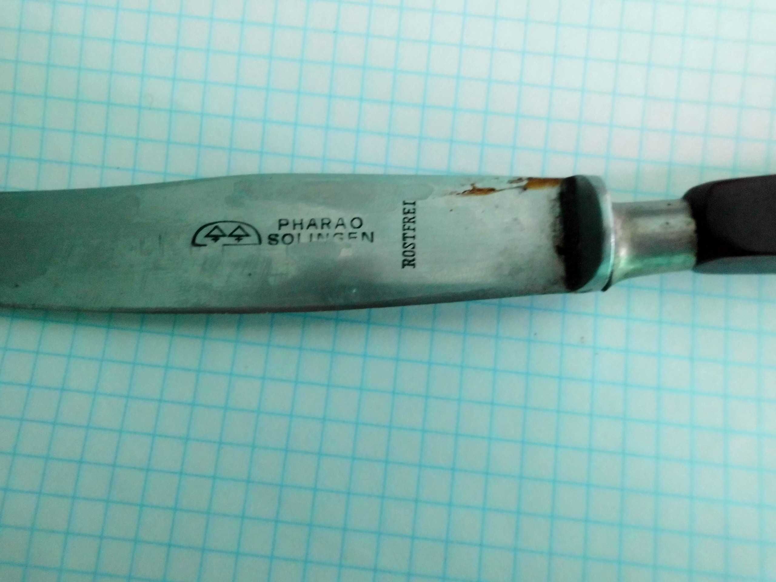 Нож столовый solingen Германия ручка  красный бакелит