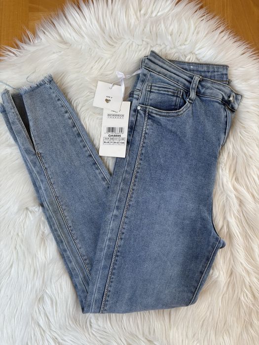 Damskie jeansy spodnie niebieskie rozmiar 31