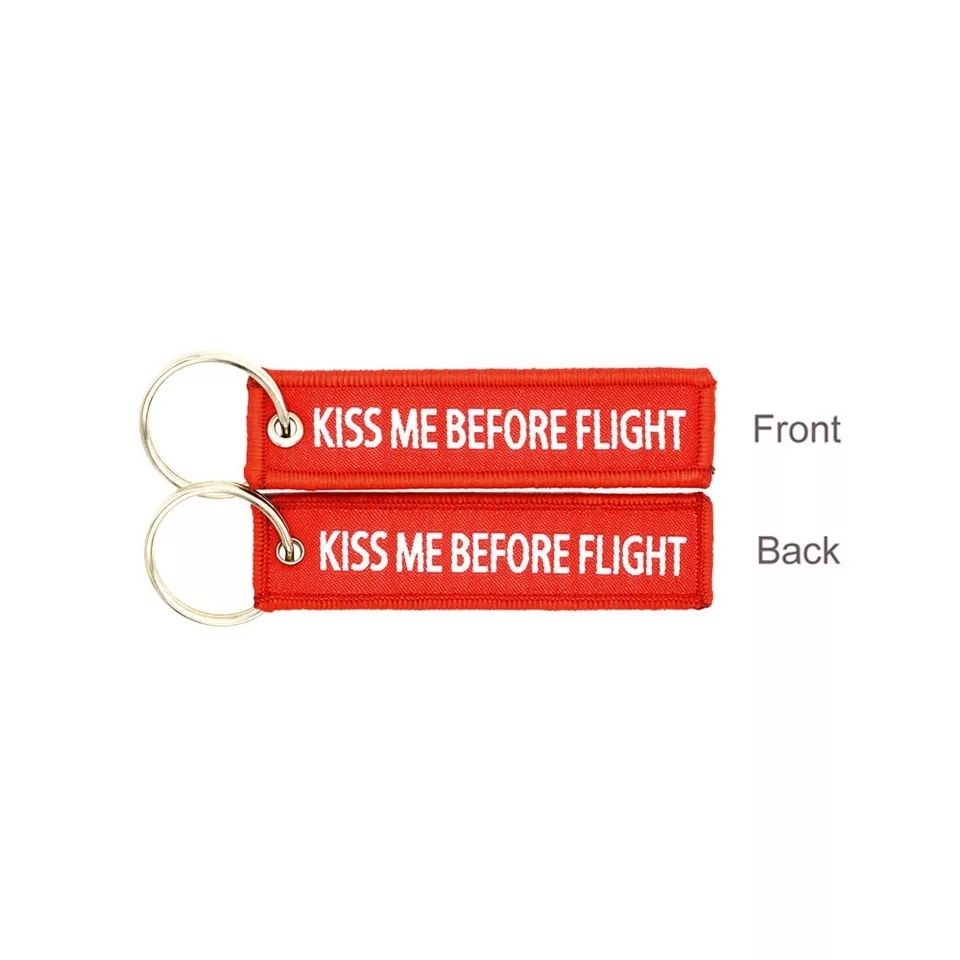 Brelok breloczek kiss nie before flight dla podróżnika