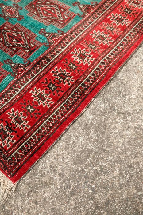 ręcznie tkany wełniany dywan w odcieniach zieleni