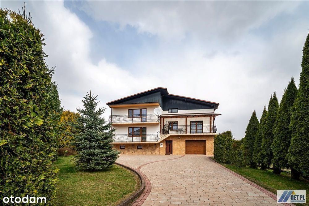 Dom z ogrodem i garażem gotowy do zamieszkania