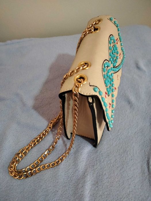 mala nova em couro trabalhada