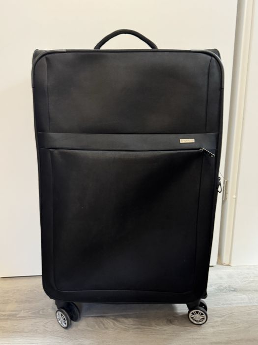 Терміново Велика валіза з поворотними колесами