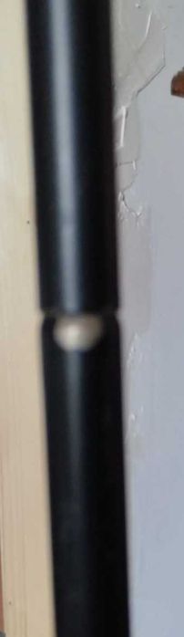 Wood and metal clothes hanging rail