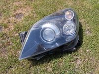 Lampa Opel Astra H III lewy przód Bi-Xenon skrętny Hella GM kompletna