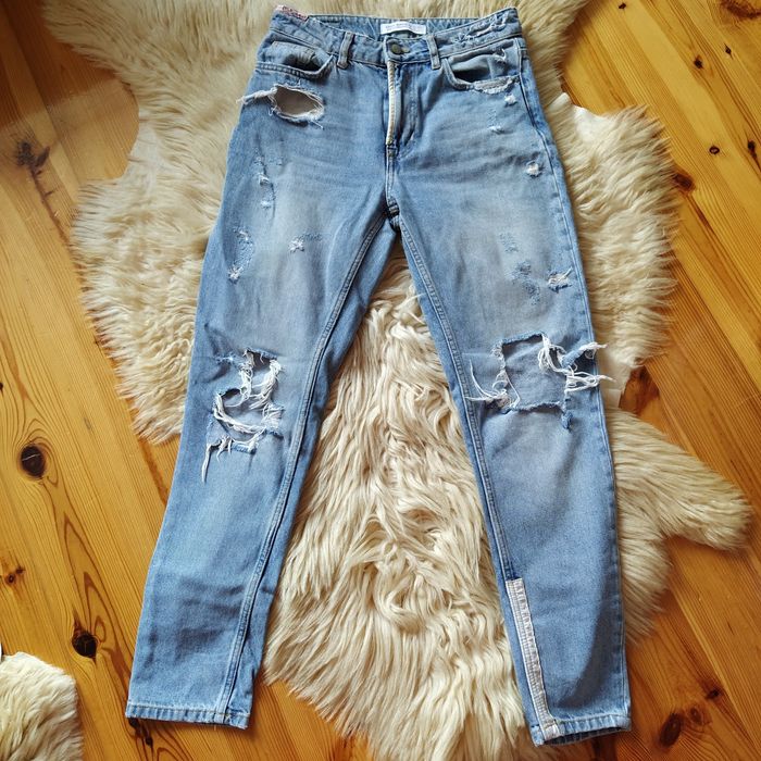 Spodnie jeansowe z przetarciami Zara