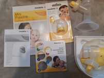 Laktator Medela  mini electric z dodatkami