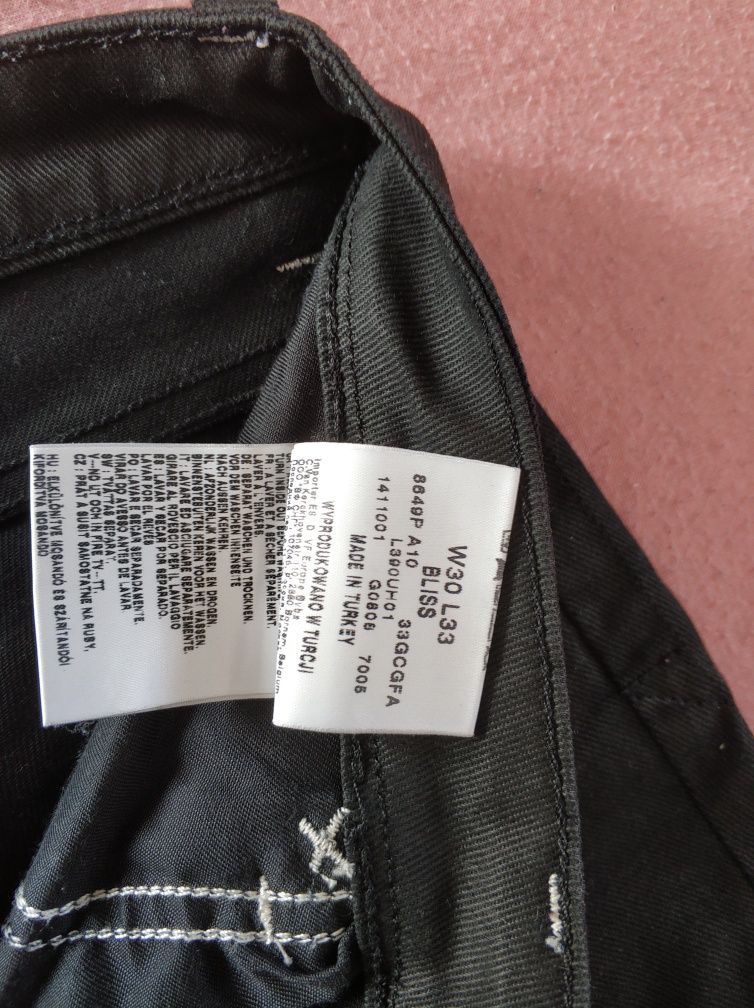 Lee woskowane spodnie czarne 30/33