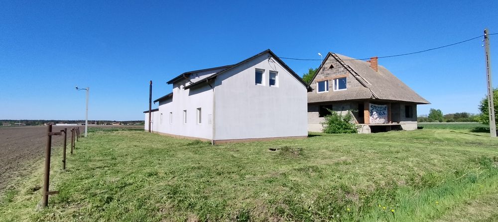 Sprzedam działkę z budynkami