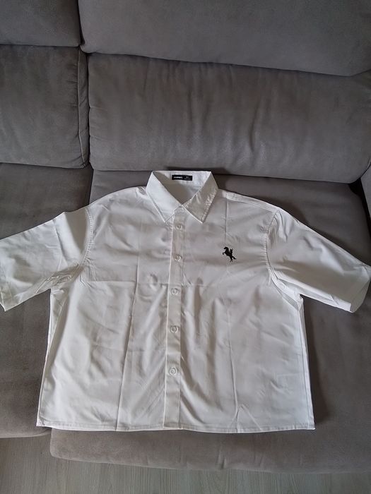 Camisa masc. adulto tam S,branca, sem uso,mede 58 cm alt,53 cm ombros