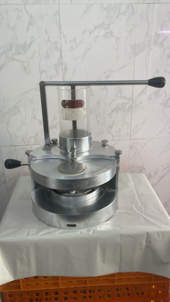 Maquina transformadora de hamburgueres