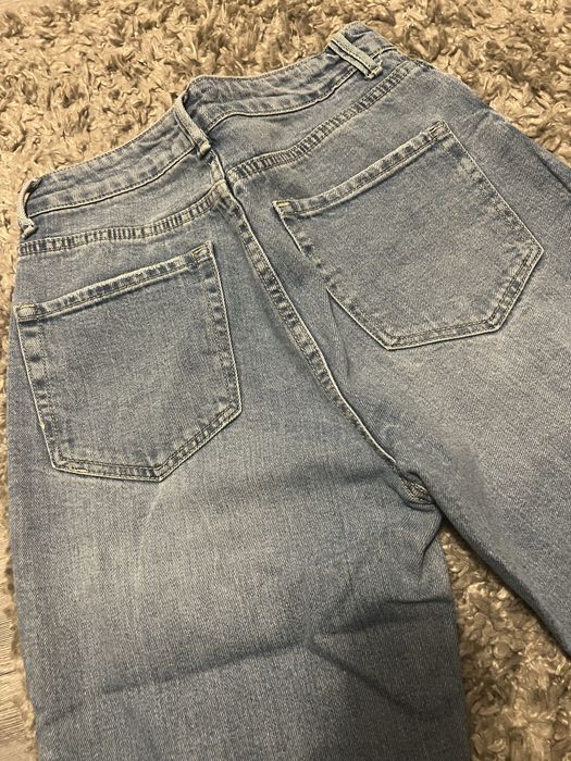 Jeansy dzwony niebieskie 36, z przetarciami