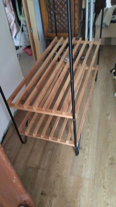 Wood and metal clothes hanging rail