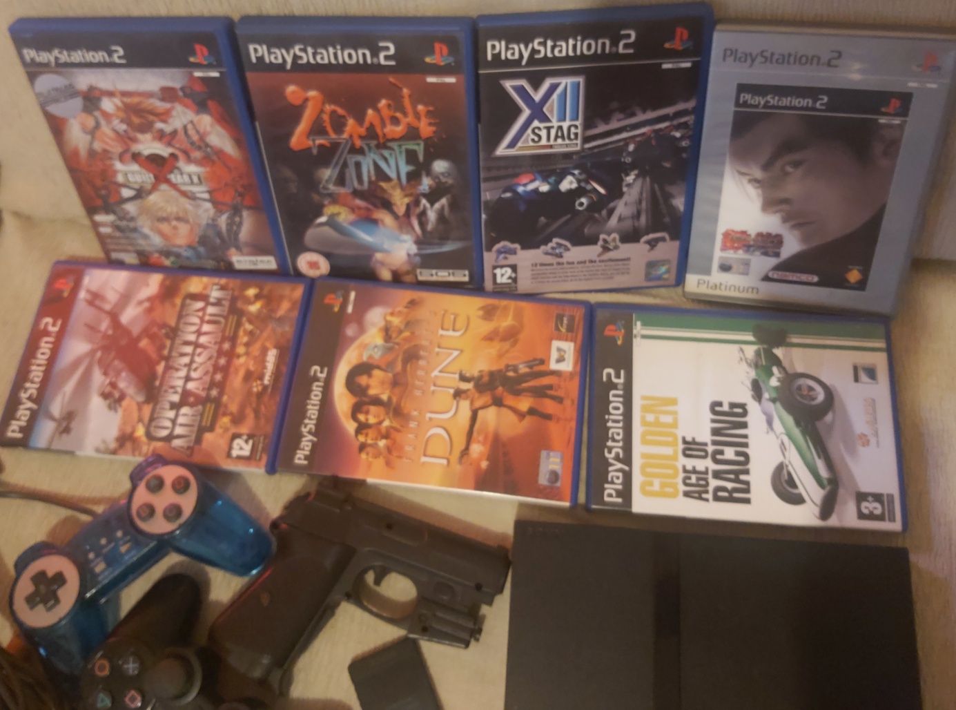 Ps2 com jogos comando cartão de memória pistola e comandos buzz.