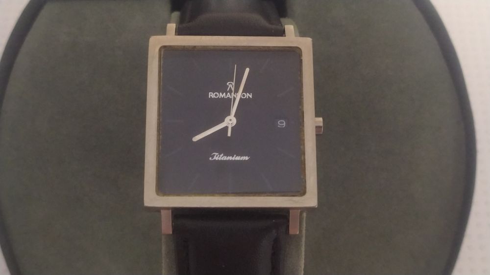 Часы ROMANSON titanium.