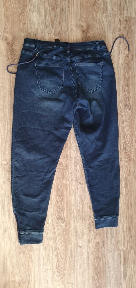 Nowe spodnie NEXT  joggery rozmiar L 42 kolor granatowy