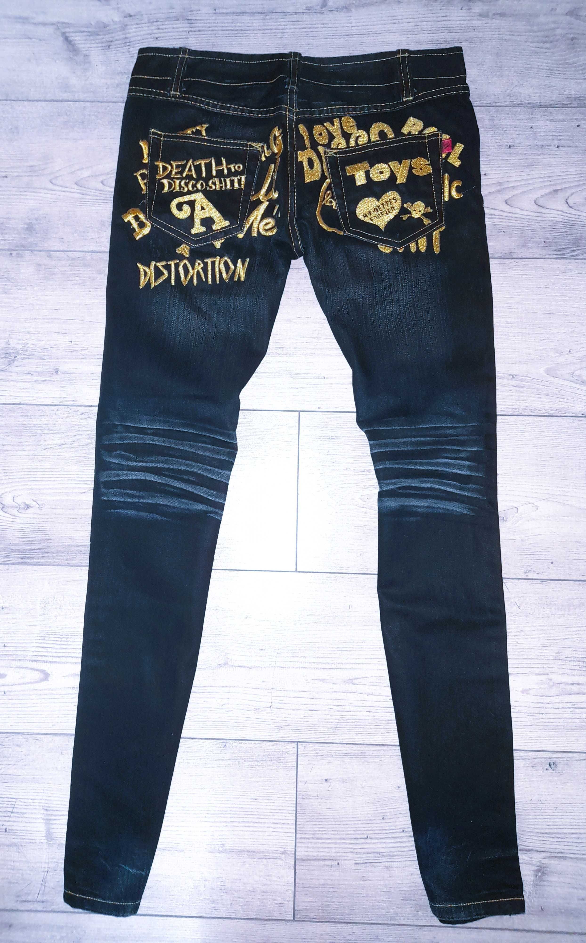 Czarne jeansy rurki złota nitka hafty