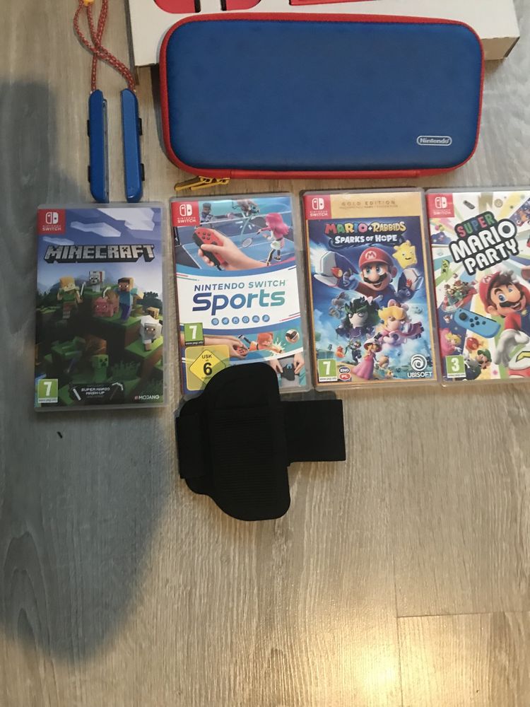 Nintendo Switch Mario Red & Blue Edition + 4 gry + opaska na noge