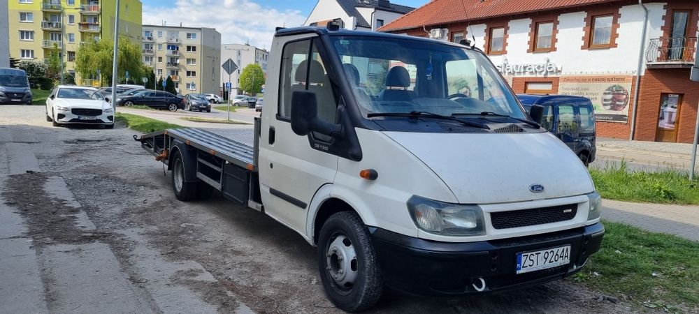 Pomoc drogowa. Usługi. Autolaweta. Transport aut