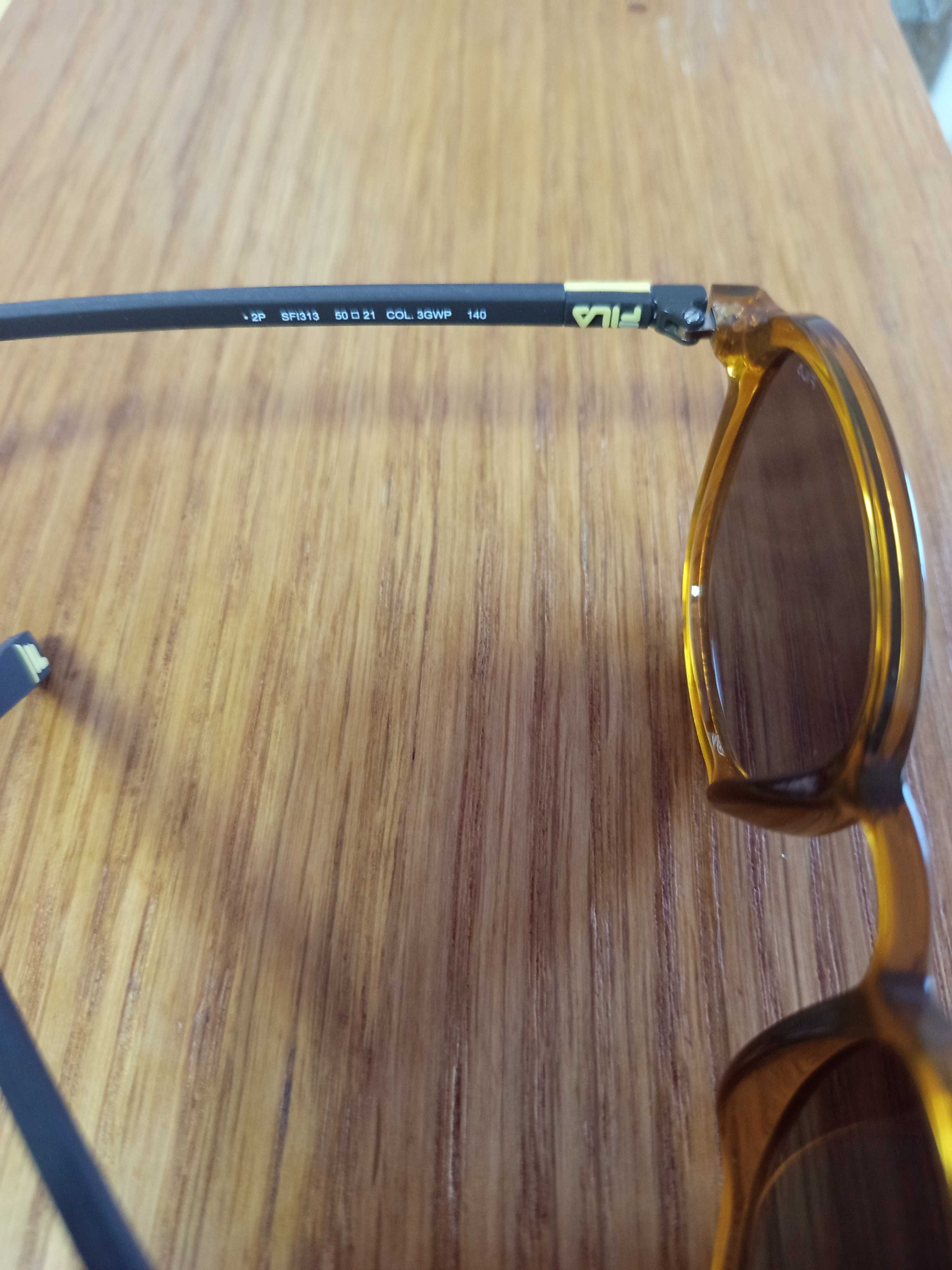 Excelentes muito bonitos oculos de sol da Fila com fatura