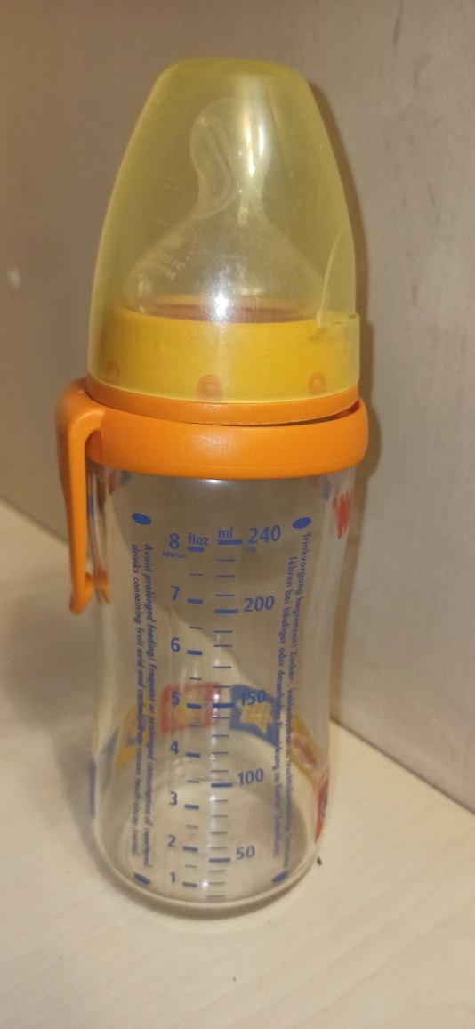 Стеклянная бутылочка Nuk с антиколиковой соской,240 млл