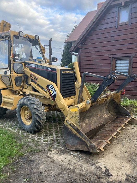 Koparko-ładowarka Caterpillar 438