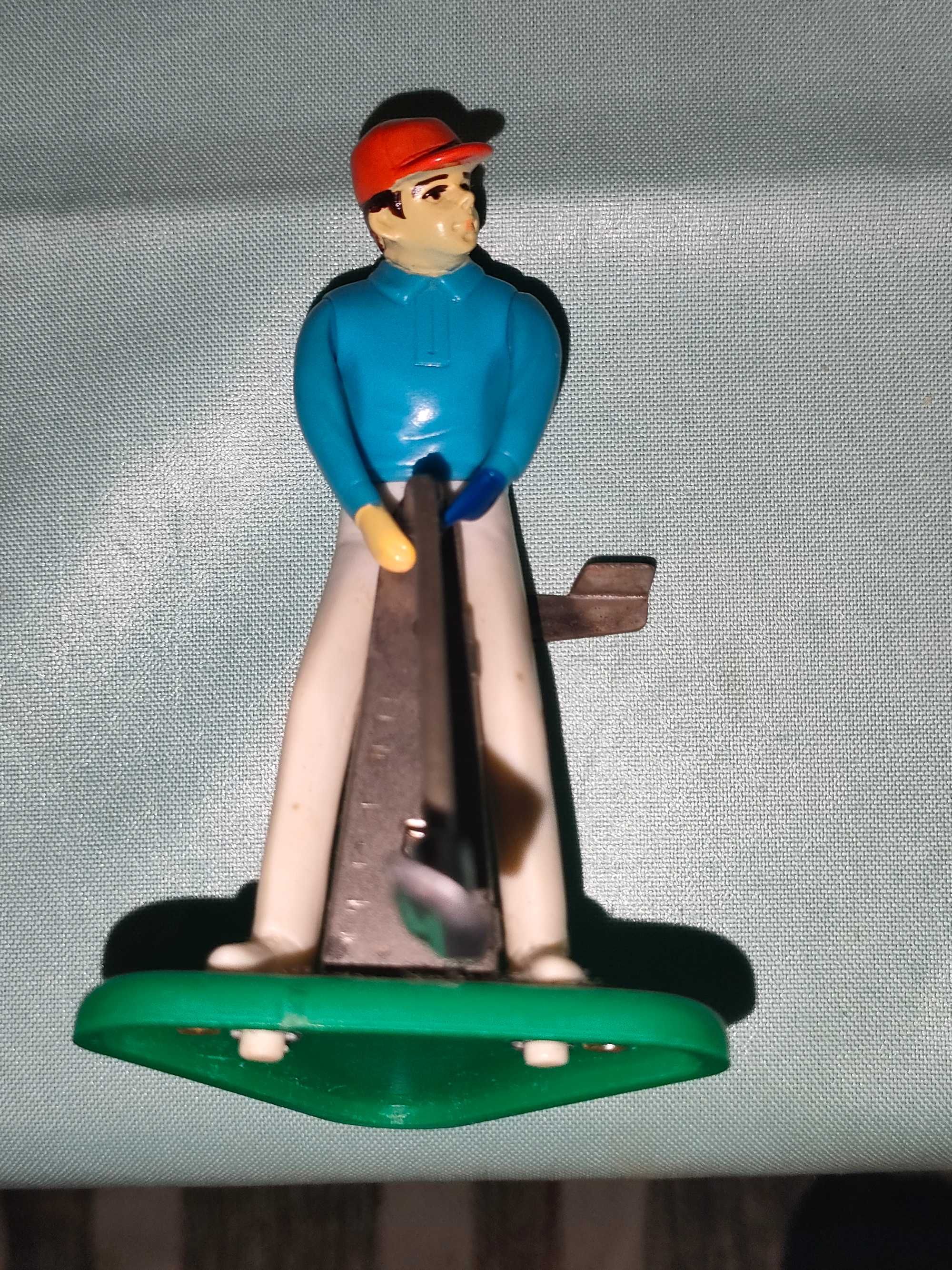 Jogador de Golfe antigo