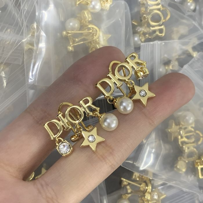 Nowe kolczyki Christian Dior CD stal nierdzewna