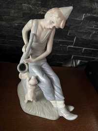 Grajek uliczny muzykant chłopiec i pies figurka porcelana szkliwiona