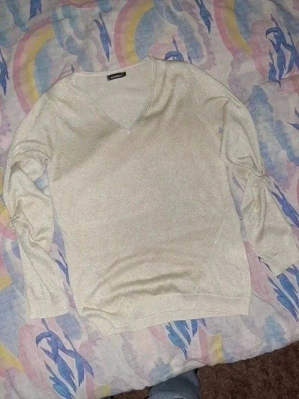 Bluza z brokatem XS
IN EXTENSO