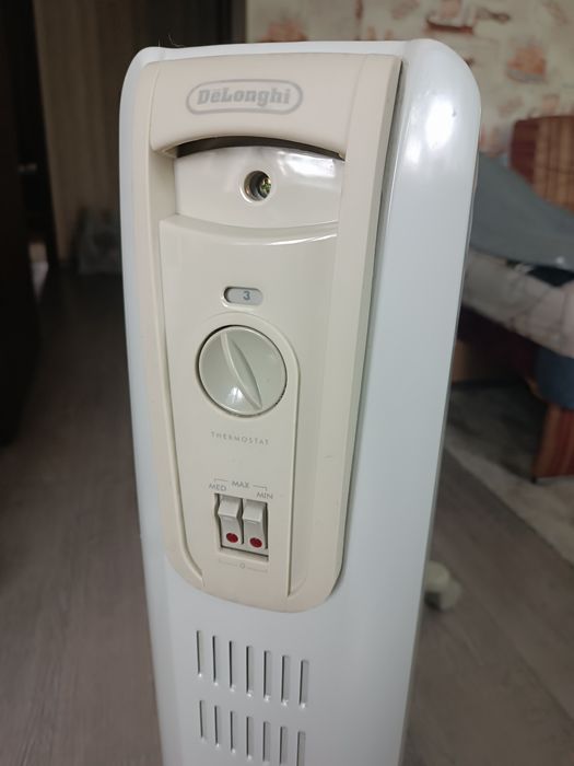 Масляный обогреватель Delonghi