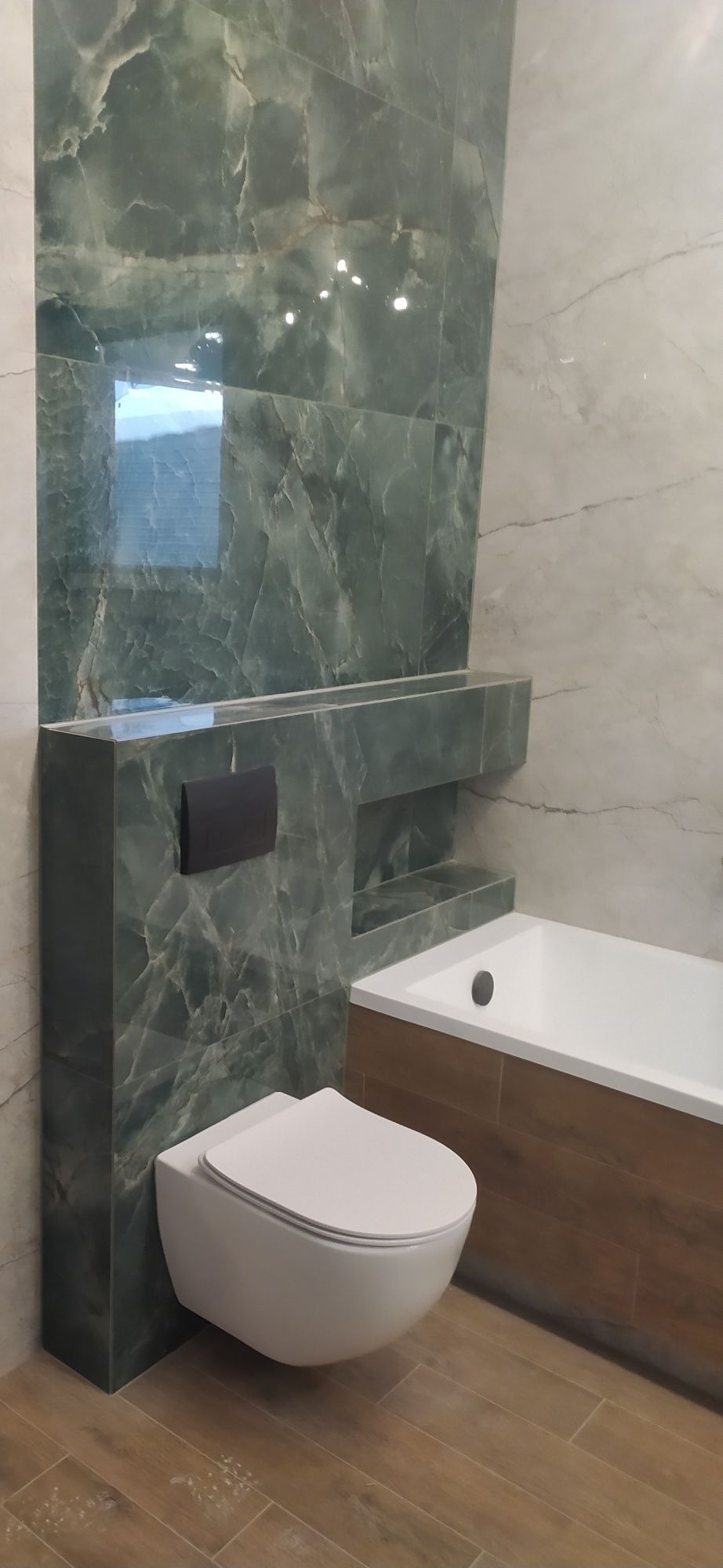 Remont łazienki  Ukladanie plytek