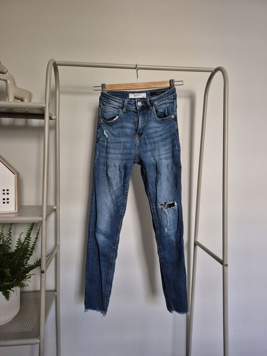 Niebieskie rurki jeansy spodnie z dziurami skinny reserved 32 XXS