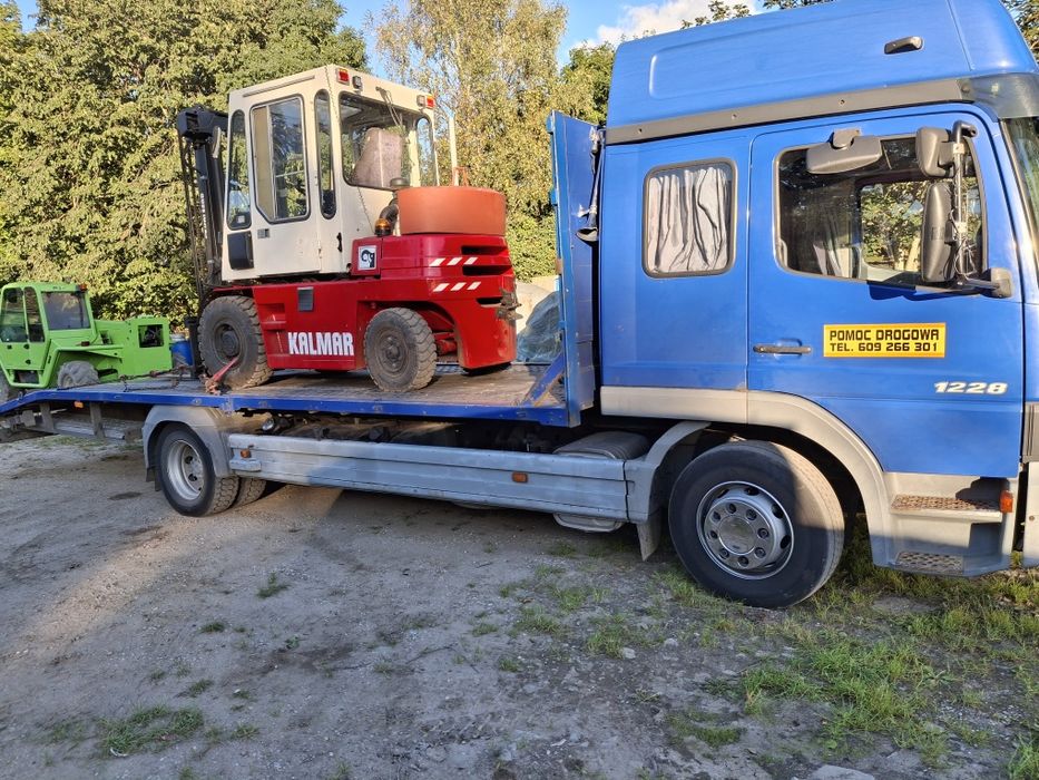 Laweta transport pomoc drogowa koparka ładowarka wozek bus ciezarowe