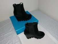 Botas pretas com salto