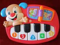 Piano eletrônico Fisher price em francês