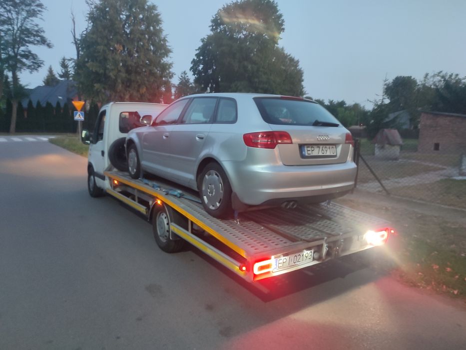 Autolaweta Laweta Pomoc drogowa transport samochodów osobowych maszyn