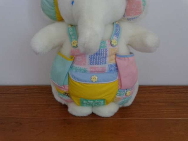 Peluche elefante com bolsos porta acessorios bébé