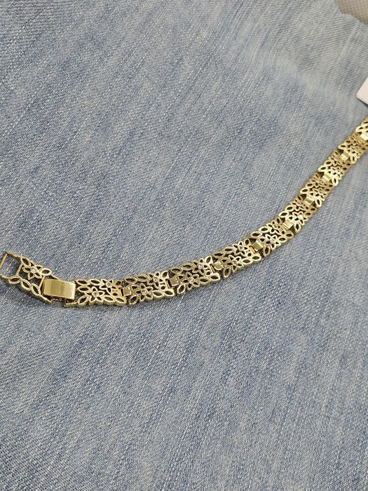 Bransoletka ażurowa kwistki z cyrkoniami stylizowana na Apart kolor zł