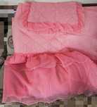 Colcha com uma fronha cor de rosa sollteiro