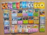 Bulk oryginalnych kart Pokemon (M17) - 200 sztuk + dodatki