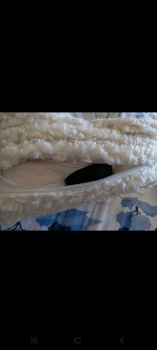 Almofada para pés, de lã, com magneto-terapia.