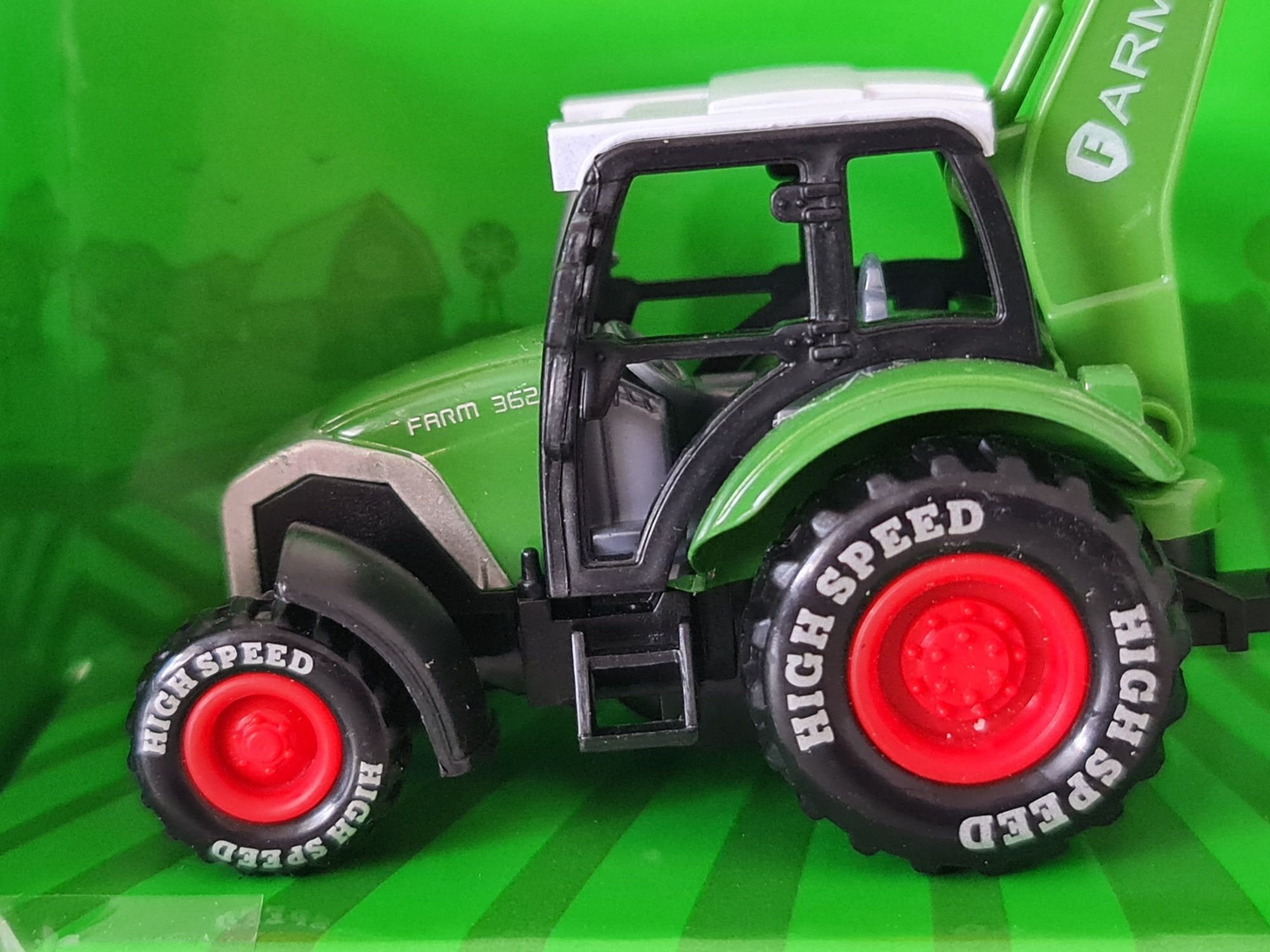 2 zabawkowe modele traktorów z akcesoriami