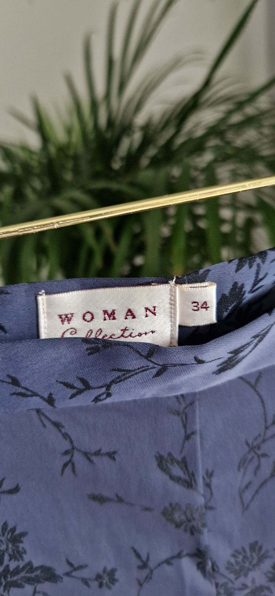 Granatowe eleganckie spodnie damskie z kwiatami Woman Collection