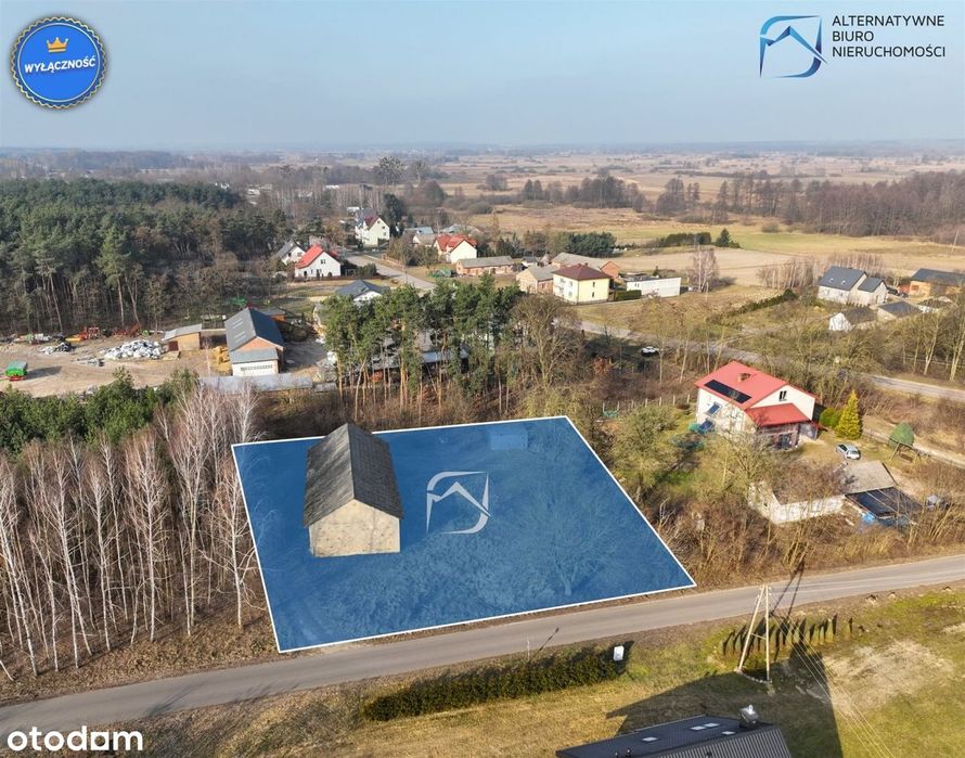 Ustawna działka w leśnym zaciszu z budynkiem gosp