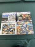 Conjunto de 4 puzzles de 1000 peças( 1 deles por abrir)