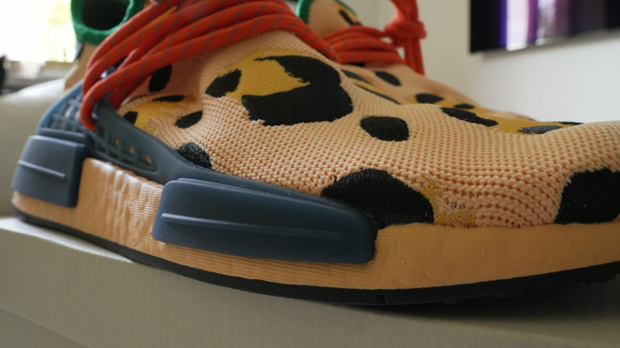 Adidas
x Pharrell HU NMD Animal Print "Amber" sneakers